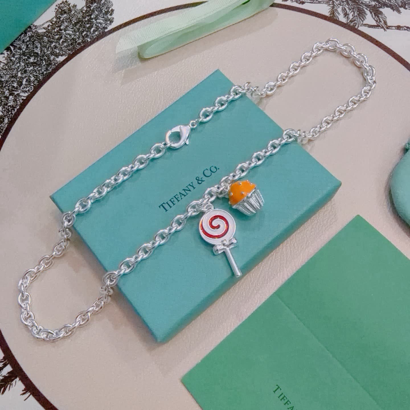 Tiffany & Co. Silver Charm Necklace with Lollipop and Cupcake Charms